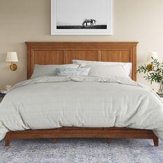 This low-profile platform bed has clean lines and a traditional look that's ideal for anchoring spaces of all styles. It's made from solid and engineered wood and features a panel design with three recessed grooves for added visual intrigue. An array of finish options means it's easy to get just the right look for your space, while the two side drawers offer must-have extra storage for blankets and pillows or your winter wardrobe. Best of all, thanks to the sturdy slat system and center supports