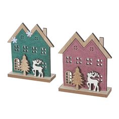 two wooden houses with deer and snowflakes on the roof, one pink and one green