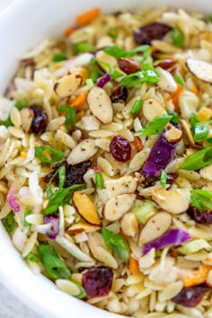 a white bowl filled with rice and veggies