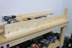 a workbench with tools and construction supplies on it's shelves in a room