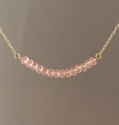 Pretty pink cherry quartz stones line up in a row and hangs on a 14k gold fill, 14k rose gold fill, or sterling silver chain. Stones measure approx 1.5 inches lined up. You can choose the length you want when you checkout. If you want a size smaller than 16 inches, let me know when you checkout. You can add an extension chain to your necklace by adding this item to your cart: https://www.etsy.com/listing/182425506/add-on-extension-chain-gold-fill-or Item comes packaged in a little brown box. Pearl Jewelry Gift, Pearl Strands Necklace, Cherry Quartz, Pearl Necklace Earrings, Pink Rose Quartz, Silver Bead Necklace, Cultured Pearl Necklace, Gemstone Beaded Necklace, Gold Bead Necklace