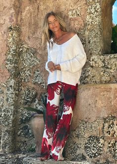 MANDY PANT RED HIBISCUS The Mandy Pant is a must-have piece in your LaRue wardrobe! Its comfort and versatility make it perfect for dressing up or down. Make it yours by pairing it with your favorite top and our signature kaftans - a style combo that will be sure to turn heads! Each Individual piece has a unique and eye-catching print. Drawstring waist Straight relaxed leg 100% Crepe De Chine Hand Wash or Delicate Cycle and Hang Dry The print is an original Ramona La Rue hand painted by the desi Red Hibiscus, Black And White Flowers, Mini Dress Casual, Light Sweater, Kaftan Dress, Mix Match, Hibiscus, Print Dress, Jumpsuit Romper