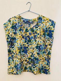 "This is a really lovely vintage 1950's hand made simple top with short sleeves in a gorgeous floral textured fabric, it is a simple top with no opening, it is in good vintage condition, it is a size uk 10. All garments are worn but in a good vintage condition, there may be small signs of wear or very minor flaws that are due to come with the items age but any more serious flaws that we find have been pictured. We do not except any returns for any sizing issues since we provide measurements, mak Cotton Ditsy Floral Print Short Sleeve Blouse, Cotton Blouse With Ditsy Floral Print And Short Sleeves, Blue Short Sleeve Top With Ditsy Floral Print, Blue Ditsy Floral Print Short Sleeve Top, Blue Short Sleeve Tops With Ditsy Floral Print, Flower Top, Simple Top, Small Signs, Flower Tops