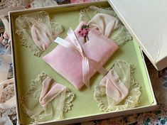 Vintage old estate found small hanky and sachet set in original box. Very pretty little pink satiny hanky and looks like maybe a little padded sachet piece in the center. Still attached to its paper backing. Age worn and shabby though lovely little display prop piece. I've added the tied-on ribbon and little flowers to the outside of the box for display...photo 7. Of course given its age and storage all these years the hanky is especially wrinkled and misshapen especially if you decide to remove Vintage Handmade Handkerchiefs As Gifts, Elegant Pink Handkerchiefs For Gifts, Handmade Vintage Handkerchiefs As Gift, Vintage Cream Handkerchiefs Gift, Retro Red Handkerchief Gift, Pink Handkerchief, Vanity Display, Vintage Multicolor Spring Handkerchiefs, Pin Up Photos