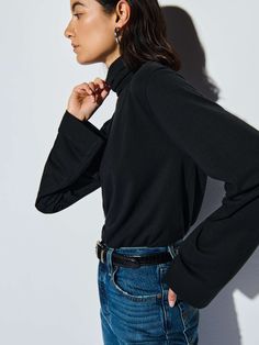 This versatile folded turtleneck top features side slits and a relaxed fit for that effortless cool factor without the fuss. (You might need every color). )This one comes in Jet Black.) | Neo Top in Jet Black | Ethical Essentials Mock Neck And T Shirt, Nation Ltd, Turtleneck Top, Black Ballet Flats, Mock Neck Top, Women Lifestyle, Turtle Neck Top, Pima Cotton, Jet Black