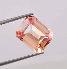 AAA Flawless 12 x 9 mm Natural Ceylon Peach Padparadscha Sapphire Loose Emerald Cut 8.15 Ct Gemstone Ring And Jewelry Making GIT Certified GEMSTONE SPECIFICATION :-    TOTAL CARAT WEIGHT = 18.15 CT LENGTH = 12.25 MM WIDTH = 9.80 MM DEPTH = 6.50 MM DIMENSION = 12.25 x 9.80 x 6.50 MM PRODUCT DETAILS THEY ARE SYMBOLIC. FOR THE MOST PART, THE PEACH PADPARADSCHA SAPPHIRE IS USED TO SYMBOLIZE OPEN COMMUNICATION AND CLARITY OF THOUGHT. APART FROM THIS, THE STONE IS ALSO ASSOCIATED WITH LOVE, TRUTH, FAITH AND COMMITMENT. THESE REPRESENTATIONS HAVE MADE THE JEWEL A POPULAR GIFT AMONG COUPLES. PEACH PADPARADSCHA SAPPHIRE IS A UNIQUE AND SPECIAL VARIETY OF CORUNDUM THAT FEATURES TWO OF NATURE'S MOST MAJESTIC COLORS: DEEP OCEAN BLUE AND VIVACIOUS GREEN ANOTHER NAME THAT IS WIDELY USED TO DESCRIBE YELL Open Communication, Loose Emeralds, Padparadscha Sapphire, Yellow Sapphire, Black Spot, Sapphire Gemstone, Ancient Egyptian, Gemstone Ring, Emerald Cut