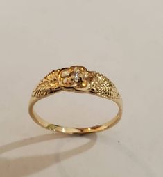 This is a beautiful 14KT yellow gold 5 pedal rose ring accented with a 3 pt si 1 gh color .03 pt diamond. Can be set with a different stone by request.This is one of my first carvings paying close attention to detail. Will always remain a classic. Comes in sizes 5 to 8. Allow 10 days handling time. Mexican Gold Jewelry Rings, Asian Gold Rings, 18k Gold Rings, Gold Floral Ring, Gold Ring Aesthetic, Xoxo Jewelry, Gold Initial Ring, Fantasy Earrings, Engagement Earrings