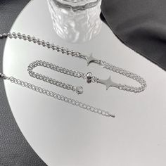 ✦ This choker necklace features a unique combination of star and cross charms, along with a half cuban chain and half silver beads. It has an edgy and cool aesthetic, making it a great gift for a boyfriend or as a matching accessory. Its mismatched style adds a touch of uniqueness, perfect for casual outings and adding fun to any outfit. ----------- DETAILS ----------- - Color: Silver - Size (Length): 50cm - Materials: Stainless Steel - SKU: O28 Gift For A Boyfriend, Cool Aesthetic, Y2k Necklace, Basic Jewelry, Crystal Hoop Earrings, Nose Rings Hoop, A Boyfriend, Chain Choker Necklace, Fashion Jewelry Earrings