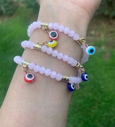 Evil Eye 🧿 Beaded Bracelet In many cultures, it is believed that evil eye bracelets protect against misfortune, evil looks and negative energy. Wear your bracelet for good luck and protection. ✨ Pink Evil eye protects your friendships and exhibits a calming, relaxing feeling. ✨ Pink Evil Eye Bracelets With Round Beads, Pink Bracelets With Evil Eye Round Beads, Pink Beaded Bracelets With Evil Eye, Pink Evil Eye Round Beads Bracelets, Pink Beaded Bracelet With Evil Eye, Pink Evil Eye Bracelet With Round Beads, Pink Beaded Evil Eye Bracelets As Gift, Spiritual Evil Eye Bracelet With Round Beads For Friendship, Trendy Evil Eye Bracelet With Round Beads As Gift