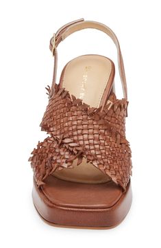 Woven leather straps crisscross over the vamp of a weekend-ready slingback sandal lifted by a subtle platform and flared block heel. 3 3/4" heel; 3/4" platform (size 39) Adjustable slingback strap with buckle closure Cushioned footbed Leather upper and lining/synthetic sole Imported Slingback Sandal, The Vamps, Sandal Women, Platform Sandals, Block Heels, Leather Straps, Womens Sandals, Brown Leather, Leather Upper