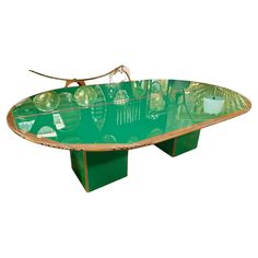 an oval glass table with metal legs