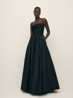 Weddings are in the air. Shop the Kastoria Dress from Reformation, a fitted maxi dress with a straight neckline, a-line skirt, and a pleated front. Black Tie Wedding Guest Dress, Black Tie Wedding Guests, Black Bridesmaids, Fitted Maxi Dress, Black Dress Formal, Black Tie Dress, Black Bridesmaid Dresses, Swimwear Dress, Black Tie Wedding