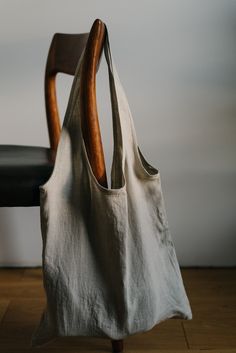 A minimalist fold away natural linen tote bag. Also available without the fold. You can choose other colors and type (regular or foldable) in the drop down menu when purchasing. Quiet objects tote bags are minimalist pieces that help you take care of your shopping needs. It is an elegant tote bag, made from a single piece of linen fabric. This bag folds into itself by using a pocket drawstring which is inside of the bag, so it still looks minimalist from the outside. When folded it turns into an Summer Linen Canvas Bag For Everyday Use, Everyday Linen Shoulder Bag For Summer, Summer Linen Canvas Bag, Casual Natural Linen Canvas Bag, Canvas Bag For Daily Summer Use, Summer Linen Canvas Bag For Daily Use, Minimalist Summer Bags For Everyday Use, Summer Linen Shoulder Bag For Everyday Use, Casual Linen Canvas Bag For Everyday