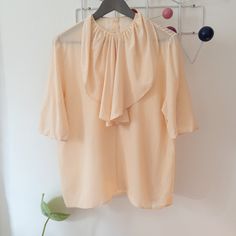 Vintage gorgeous peach silk blouse. Such a special piece for you collection. Elegant and light ruffle neckline.  Pretty button back closure and one snap. In pristine condition.  Flat measurements: 16 shoulders, 18 waist, 26 length. *Please review our description and photos thoroughly, as all sales final, no returns. Feel free to convo if you have specific questions. Wool Berets, Pink Tshirt, Wool Plaid, Silk Blouse, Vintage Pink, Womens Clothing Tops, Portland, 1970s, Blouses For Women