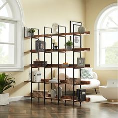 a living room filled with lots of furniture and decor on top of bookshelves