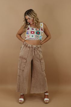 Radiate retro vibes with the Down For It Distressed Cargo Pants from our Patchwork collection. With their vintage inspired distressing these pants effortlessly capture a timeless and trendy aesthetic. Mineral wash Cargo style Elastic waistband Adjustable tie waistband Functional pockets Cropped Fabric: 100% cotton Imported INSEAM: Small: 25 1/2 Medium: 26 Large: 26 Model Specs: Emily is wearing a size small in the photo. How will this item fit you? Check out our MODEL SPECS(Typical Sizing - Karl Wed Leg, Trendy Aesthetic, Everyday Chic, Cargo Style, Cargo Pant, Chic Boutique, Retro Vibe, Cargo Pants, Mocha