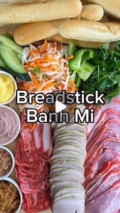 an assortment of breadsticks, meat and vegetables on a cutting board with the words breadstick bann mi