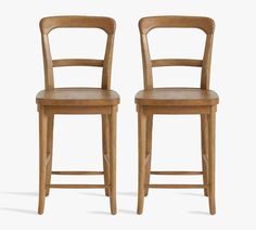 two wooden chairs side by side against a white background