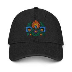 Inspired by Polish Wycinanki art, our Embroidered Denim Dad Hat blends tradition with modern style. Vibrant colors and detailed embroidery make it a unique accessory. Crafted for comfort and versatility, this hat is perfect for any occasion. Elevate your look with a touch of Polish flair! Complement your everyday wardrobe with this pigment-dyed denim hat! Made out of 100% cotton, the 6-panel cap offers a light feel, while the adjustable strap ensures a solid and comfortable fit. Black Embroidered Cotton Hat, Embroidered Black Cotton Hat, Embroidered Cotton Hat With Curved Brim, Adjustable Embroidered Cotton Hat, Traditional Embroidered Baseball Cap, Casual Embroidered Festival Hats, Traditional Embroidered Hats For Spring, Traditional Embroidered Spring Hats, Polish Heritage