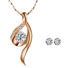 The unique and elegant design of this crystal necklace is eye-catching and beautiful. This necklace is truly a classic piece of jewelry that will go great with all outfits. Pair the necklace with an elegant evening gown as the perfect finishing piece, or wear the necklace to dress up a casual outfit. Necklace Dimensions: Pendant 1.06" x 0.5", 16" chain with 2.25" extendable chain. Necklace Material: Tin Alloy. Earrings Dimensions: 0.19 inch in diameter. Earrings Material: Crystal Elegant Evening Gown, Lace Tape, Baby Hair Accessories, Spa Gifts Set, Alloy Earrings, Anklet Bracelet, Jewelry Stand, White Crystal, Anklet Jewelry