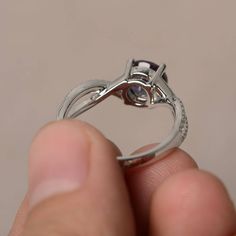 This is a gorgeous handmade creation. Its beauty is its simplicity & Elegance. The 7*7 mm round shape faceted lab Alexandrite is crafted in solid sterling silver and with rhodium plated. All item is sent in a beautiful gift box If you have any idea of design your ring,pls contact me directly. You can realize more lovely stuff clicking the link https://www.etsy.com/shop/knightjewelry?refshopsection_shophome_leftnav Please leave the correct address and you phone number for delivering successfu Engagement Rings Round Cut, Alexandrite Rings, Engagement Rings Twisted, Alexandrite Engagement Ring, Alexandrite Ring, Round Cut Engagement Rings, Gemstone Engagement, Engagement Rings Round, Twist Ring