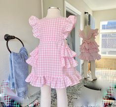 This darling all cotton pink gingham pinafore dress offers loads of ruffles in Carolina Gingham fabric from Robert Kaufman so it's premium cotton and breathable to feel great in the summertime. As is custom with Playful Princess items, the design has our signature flexible fit without fasteners and zippers that may break over time. Adjustable straps loop through the back to tie in a sweet bow. Throw it on over a shirt for a vintage pinafore look during any season. Cute Ruffled Plaid Dress For Spring, Summer Gingham Plaid Dress With Ruffle Hem, Cotton Gingham Plaid Dress With Ruffles, Cotton Plaid Ruffled Dress For Picnic, Gingham Dress With Ruffled Hem And Straps, Fitted Gingham Plaid Dress With Ruffles, Gingham Plaid Cotton Dress With Ruffles, Cotton Plaid Dress With Ruffles For Picnic, Gingham Dresses With Ruffles For Picnic