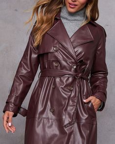 From daytime chic to evening glam, the Sylva Long Faux Leather Trench Coat brings undeniable drama and confidence to any occasion. Crafted from sleek faux leather fabric, this trench coat exudes modern sophistication with just the right amount of edge. The double-breasted front button closure and detachable waist tie let you customize the fit, whether you want to cinch it for a tailored look or wear it loose for an effortlessly chic vibe. Faux leather fabric Double breasted front button closure Side slant pockets Detachable waist tie Buckle cuffs Back vent Lined Self: 100% Polyurethane Lining: 97% Polyester 3% Spandex Fitted Faux Leather Belted Outerwear, Belted Faux Leather Long Coat, Belted Long Faux Leather Coat, Chic Faux Leather Jacket, Sleek Belted Fall Outerwear, Chic Solid Color Faux Leather Jacket, Sleek Belted Outerwear For Fall, Chic Fall Outerwear For Date Night, Sleek Belted Leather Jacket For Fall