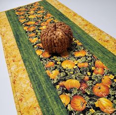 a table runner with an orange ball on it