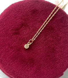 Wow! This diamond has so much sparkle. It is a genuine directly imported White colored  diamond and is simply set in a solid 14kt gold bezel setting and hangs from a solid 14kt gold chain. Please choose either a 16 inch chain or 18 inch chain from the drop down menu. If you want just the charm and No chain-choose '0'  Details: - Genuine White fully faceted diamond. Directly imported. Measures 2.5mm round and weights 0.09 carats. Very clear-bright and top quality. This price is amazing for a diam Tiny Star, Diamond Fashion, Delicate Necklace, Solid Metal, 14kt Gold, Bezel Setting, White Diamond, Gold Pendant, Gold Chains