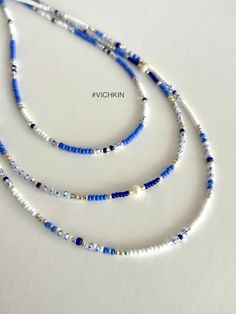 "Dainty Blue beaded necklaces with fresh water pearles and gorgeous royal blue beads in \"old money\" style.   Made with delicate high quality Czech glass seed beads. Get for yourself or gift to a friend. ♥   #vichkin #vichkindesign ↠ ABOUT    ▢  Size: about 15 inch, goes up to about 17 inch with chain extension.  ▢  Materials: 2mm / 3mm quality Czech glass seed beads  ▢  This item is handmade and may vary slightly from the picture, making every one completely unique.  ▢  Ready to ship. ↠ IMPORTANT The product is not suitable for young children. Please exercise child  Please check out my Jewelry Collection here: https://www.etsy.com/ca/shop/Vichkin?ref=seller-platform-mcnav§ion_id=22731346 Back to main page https://www.etsy.com/ca/shop/Vichkin All my items are handmade with love ♥  Natalie Summer Seed Bead Necklace, Boho Ocean, Beaded Chocker, Coastal Granddaughter, Blue Beaded Necklace, Old Money Style, Blue Beach, Summer Necklace, Fancy Jewelry