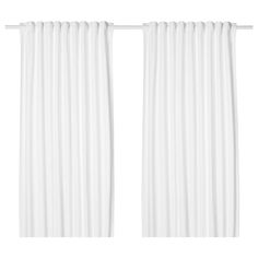 two white curtains hanging on the side of a window