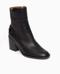 The babette is a block-heeled round-toe boot with a stepped collar. a half belt and loop detail adorn the heel. babette exudes quality in rich italian grain leather and its substantial stacked leather heel. inside-zip closure.fit: the babette boot in black fits true to size. see our size guide to find your coclico size.    italian certified sustainable grain leather  heel height: 70mm  leather sole  made in spain Chic Moto Boots With Stacked Heel And Square Toe, Chic Heeled Boots With Buckle Closure And Block Heel, Chic Moto Boots With Stacked Heel And Round Toe, Chic Moto Boots With Stacked Block Heel, Chic High Ankle Moto Boots With Stacked Heel, Moto Ankle Boots With Stacked Heel For Work, Leather Boots With Block Heel And Heel Loop, Leather Boots With Heel Loop And Block Heel, Workwear Moto Boots With Stacked Heel