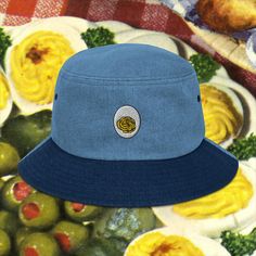 Show your love of deviled eggs with this embroidered denim hat! Here's an accessory that'll become your main outfit piece. Get yourself this trendy, comfortable, and versatile bucket hat that'll work for all kinds of outfits--casual, sporty, and streetwear. * 100% cotton * 2 sewn eyelets on each side of the hat * Poplin sweatband * One size fits most * Blank product sourced from China Denim Blue Cotton Bucket Hat With Curved Brim, Trendy Summer Bucket Hat With Embroidered Logo, Casual Wide Brim Hats With Embroidery, Casual Wide Brim Embroidered Hats, Retro Cotton Bucket Hat With Curved Brim, Retro Brimmed Cotton Bucket Hat, Trendy 5-panel Bucket Hat For Spring, Retro Cotton Brimmed Bucket Hat, Cotton Retro Bucket Hat With Short Brim