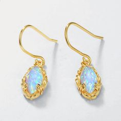 Sparkle and shine with the Opal Dangle Earrings. Their opalescent gems showcase a rainbow of hues, perfect for catching the light and radiating beauty. With a delicate dangle design, these earrings add a touch of elegance to any outfit. Elevate your style and turn heads with these stunning earrings! DETAILS Plating: 10K Gold Materials: 10K Gold on Silver, Simulated Opal, Zircon Size: 1.14 "*0.30"/29mm*7.5mm Weight: 1.57 g/pr Slight variations due to the individuality of each piece Elegant Iridescent Jewelry For Pierced Ears, Opal Drop Earrings With Gemstones, Opal Gemstone Drop Earrings, Elegant Opal Gemstone Drop Earrings, Opal Drop Earrings As A Gift, Teardrop Opal Earrings In Gold, Iridescent Teardrop Jewelry For Formal Occasions, Elegant Iridescent Birthstone Jewelry, Opal Earrings For Gift