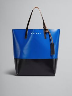 North/South open tote bag. Leather handles and tag with embossed Marni logo. Printed Marni logo. Blue Double Handle Shoulder Bag With Logo, Blue Shoulder Bag With Logo And Double Handles, Blue Top Handle Shoulder Bag With Logo, Everyday Bucket Bag With Logo, Everyday Bucket Bags With Logo, Everyday Use Bucket Bags With Logo, Blue Top Handle Bag With Logo, Blue Leather Bags With Logo, Elegant Blue Bag With Logo