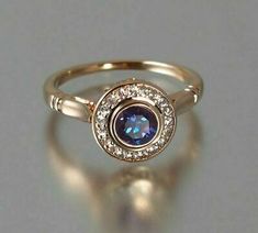 (eBay) 0.75CT Round Cut Blue Sapphire&Diamond Halo Engagement Ring 14K Rose Gold Finish Popular Rings, Alexandrite Engagement Ring, Alexandrite Ring, Round Engagement Rings, Wedding Rings Halo, Topaz Jewelry, Engagement Rings Round, Rose Gold Engagement, Halo Diamond Engagement Ring