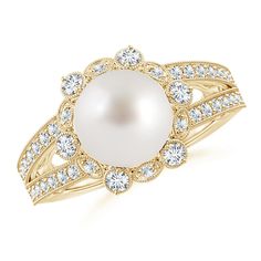 At the center of this charming pearl flower ring is a lustrous South Sea pearl. The prong set diamonds surrounding the cultured pearl create a brilliant floral halo while the pavé set diamonds on the split shank lend added glamour to the ring. Intricate milgrain detailing along the edges make this a truly exquisite pearl split shank ring in 14K yellow gold. Pearl Halo Ring, Pearl Flower Ring, Cultured Pearl Ring, Floral Halo, Split Shank Ring, Pearl And Diamond Ring, June Birthstone Jewelry, Rings For Girls, Split Shank