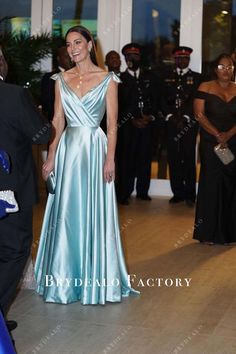 Kate Middleton in this elegant ice blue satin evening formal dress attended a reception in the Bahamas. Featuring plunging neck ruched top with winged shoulder straps, A-line floor length skirt. shown color: ice blue with build-in-bra with boning back zipper closure fully lined Elegant Light Blue V-neck Evening Dress, Light Blue V-neck Evening Gown, Elegant Light Blue Evening Dress For Banquet, Light Blue V-neck Gown For Prom, Elegant Light Blue Ball Gown, Light Blue Satin Evening Dress For Prom, Light Blue V-neck Party Gown, Formal Light Blue Evening Dress With Sweep Train, Light Blue Evening Dress For Gala