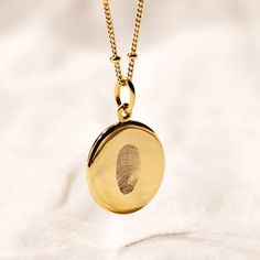 Feel forever connected to a special person or moment in your life.   Introducing our Signature Classic Fingerprint Necklace.    Diamond engraved with   a single fingerprint  , our Classic Fingerprint Necklace comes complete with   a complimentary initial or name engraving for extra meaning.    Each precious metal pendant is locally engraved with exceptional craftsmanship, and suspended from a   luxury bobble chain  , made by our artisans in Italy. Designed for daily wear as a luxury statement pi Fingerprint Jewelry Memorial, To A Special Person, Fingerprint Jewellery, Fingerprint Necklace, Handwriting Jewelry, Thoughtful Gifts For Her, Fingerprint Jewelry, Necklace Diamond, Classic Necklace