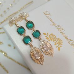 Art Deco Wedding Earrings Emerald Green Boho Bridal Earrings Vintage Fan Earrings Retro Gatsby Earrings Gold Swarovski Statement Jewelry ✅ https://luxurybridaldesignss.etsy.com ✅ https://luxurybridaldesignss.etsy.com/listing/1771475272 The photographs and design of these earrings are mine and are the property of our boutique. 💗ESMERALDA earrings ● Handmade in our production ● Comfortable to wear this jewelry all day long. ● Non-allergic, nickel-free, lead-free Art deco Vintage style earrings fo Boho Bridal Earrings, Gatsby Earrings, Boho Wedding Jewelry, 14k Gold Plated Jewelry, Vintage Fan, Earrings Emerald, Vintage Fans, Vintage Style Earrings, Deco Wedding