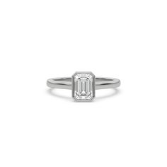 Emerald Diamond Bezel Engagement Ring is made with an emerald cut diamond set in a bezel setting on a solid gold band. Details: - Made to Order- Diamond Weight: 0.25 CT, 0.50 CT, 0.75 CT, 1.00 CT- No. Of Diamonds: 1- Diamond Cut: Emerald- Diamond Type: Lab Grown Diamond (CVD, HPHT)- Diamond Clarity: VS - Diamond Color: Colorless (DEF)- Setting Type: Bezel - Metal Type: 14K Solid Gold,18K Solid Gold- Choice of Gold Color: Yellow Gold, White Gold, Rose Gold- Jewelry Certification: Jewelry priced a Timeless Bezel-set Emerald Cut Emerald Ring, Emerald Baguette Cut Ring For Promise, Diamond Ring With Bezel Setting And Emerald Cut, Emerald Cut Diamond Ring With Bezel Setting, Classic Emerald Ring With Smooth Bezel For Anniversary, Classic Diamond Emerald Ring With Bezel Setting, Classic Emerald Cut Bezel Set Ring, Classic Emerald Diamond Ring With Bezel Setting, Classic Emerald Cut Ring With Bezel Setting