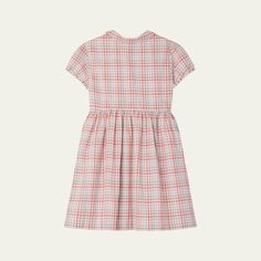 Bonpoint dress in a plaid motif with a classic embroidered cherry at the chest Peter Pan collar Short sleeves Button front Empire waist Hem falls below the knee A-line silhouette Cotton Imported Classic Gingham Dress, Gingham Cotton Dress For Daywear, Classic Short Sleeve Plaid Dress, Knee-length Gingham Dress For Daywear, Fitted Classic Plaid Dress With Short Sleeves, Classic Fitted Plaid Dress With Short Sleeves, Short Sleeve Gingham Dress For Daywear, Gingham Short Sleeve Dress For Daywear, Preppy Cotton Dress For Fall