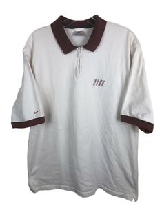 Nike Vintage Polo Shirt. White with Maroon details. Classic Maroon Nike Swoosh Logo on right sleeve. NIKE Spellout chest embroidery. 100% Cotton. Thick cotton fabric. 1/4 Zip. Great for Golf or casual wear. Men’s Large. Relaxed Oversize fit. Check Measurements: Chest - 22.5” Length - 29” Few light stains. White Collared Shirt For College, Sporty Collared Shirt For Streetwear, Classic White Tops For College, Vintage Nike Cotton Tops, Nike Cotton Short Sleeve Polo Shirt, Casual Nike Cotton Polo Shirt, Nike Cotton Collared Tops, Nike Retro Short Sleeve Top, Nike Classic Collared Tops