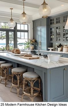 a large kitchen with gray cabinets and marble counter tops, along with bar stools