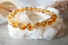 Citrine is one of the most powerful stones for manifestation and is known for new beginnings. It is often used to assist in manifesting abundance, luck, and new opportunities. Not only does this ray of sunshine bring joy and happiness, but it also attracts prosperity, balances emotions and can elevate your self-worth and self-esteem. Since Citrine is strongly connected to the Solar Plexus Chakra, it can help boost confidence and cultivate personal power. Let its bright gold energy lift you up an Cheap Yellow Crystal Bracelet For Gift, Citrine Bracelet Beads, Citrine Bracelet, Manifesting Abundance, Boost Confidence, Ray Of Sunshine, Solar Plexus Chakra, Personal Power, Solar Plexus