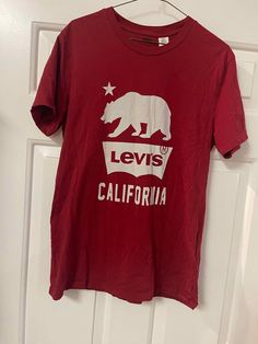 Rare find.  Levi Strauss Vintage Red T-shirt With California Bear And Print Medium Size Fitted. Nice condition.  No tears or stains. Vintage Red Top With Text Print, Vintage Red Tops With Text Print, Red Vintage Top With Text Print, Red Crew Neck T-shirt With Front Print, Red Graphic Tee With Front Print, Casual Red T-shirt With Front Print, Red Crew Neck Top With Front Print, Red Graphic Tee With Screen Print, California Bear