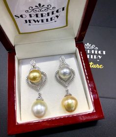 We are presenting you a HUGE pair of CHANDELIER, Genuine, Golden & White South Sea Pearls, extremely FINE A+, LUSTROUS and Rare! Accenting the 4 pearls are 110 pieces of F/VS Natural diamonds, weighting a total of 1.30 carats. Set in fabulously designed 18K solid white gold, chandelier earrings ONLY ONE ITEM AVAILABLE!! NO DUPLICATES!! WHAT YOU SEE IN THE PICTURES IS WHAT YOU WILL GET SOLIDLY HANDCRAFTED EARRINGS! SUGGESTED RETAIL VALUE: $8,500 PEARLS: Size: Bottom 14 x 15 mm, top 12 mm roun Luxury Yellow Gold Drop Pearl Earrings, Luxury White Gold Drop Pearl Earrings, Luxury White Gold Teardrop Pearl Earrings, Luxury Yellow Teardrop Earrings, Luxury Drop Jewelry With High Luster, Luxury Yellow Dangle Earrings, Luxury High Luster Dangle Jewelry, Luxury High Luster Drop Jewelry, Elegant Pear-shaped Yellow Earrings