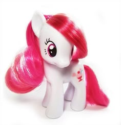 a toy pony with pink hair on a white background