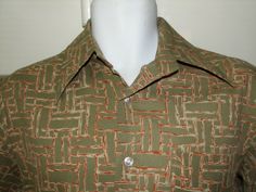 1960's or early 1970's ( Made in Hong Kong, not Korea so probably 1960's) polyester Leisure or disco shirt. From Sears Kings road store for men.1 Pocket, Well taken care of, used.   Men's current Medium :  21.5" across chest from armpit seam to seam (42" around), 29" long (bottom of back collar to bottom of shirt), 18" top back shoulder to shoulder seam.                                       Postage: USA Free 1st class.                Canada: $13.00 1st class mail                Europe & World: Fitted Green Collared Camp Shirt, Retro Fitted Green Shirt, Fitted Retro Green Shirt, Retro Green Collared Shirt, Vintage Fitted Green Shirt, Fitted Vintage Green Shirt, Vintage Green Fitted Shirt, Green Fitted Vintage Shirt, Mens Disco Outfit