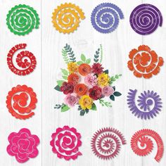 paper flowers are arranged in different colors